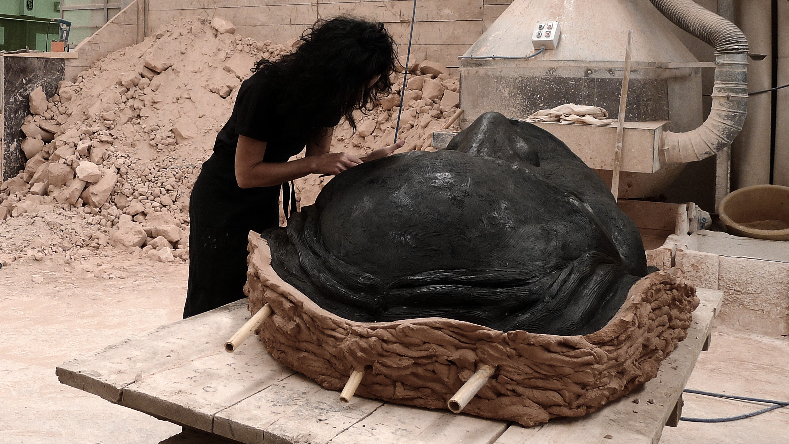 Helga Vockenhuber in her Studio. The figural sculptor is shown here at the final stage of her new art.